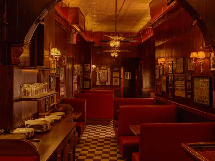 JR & Son interior with red booths, tile floors and low lighting